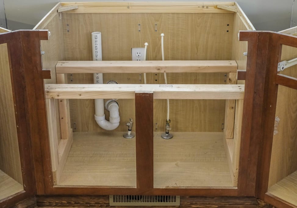 a cabinet based ready for installation of sink