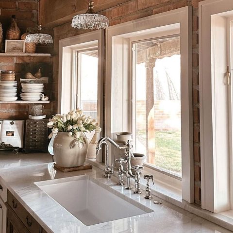 A glossy white rectangular undermount sink made in fireclay in a classic home kitchen.