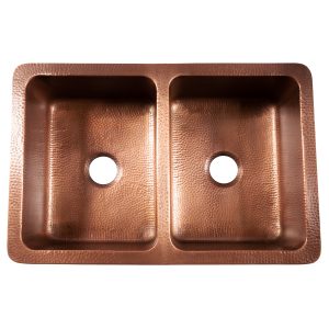 A copper rectangular undermount double basin farmhouse sink