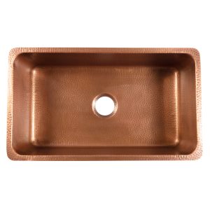 A copper rectangular undermount sink.