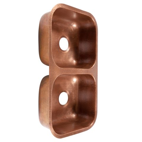 A copper rectangular undermount double basin sink.