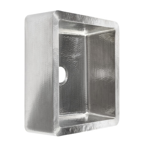 A hand hammered stainless steel farmhouse kitchen sink.