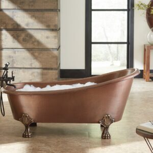 A hand hammered copper claw foot bath tub