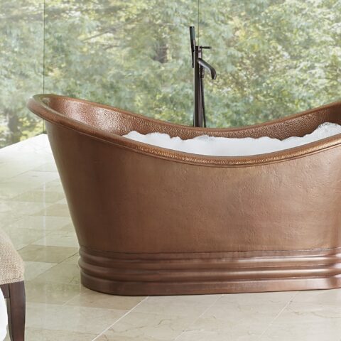 A hand hammered copper bath tub.